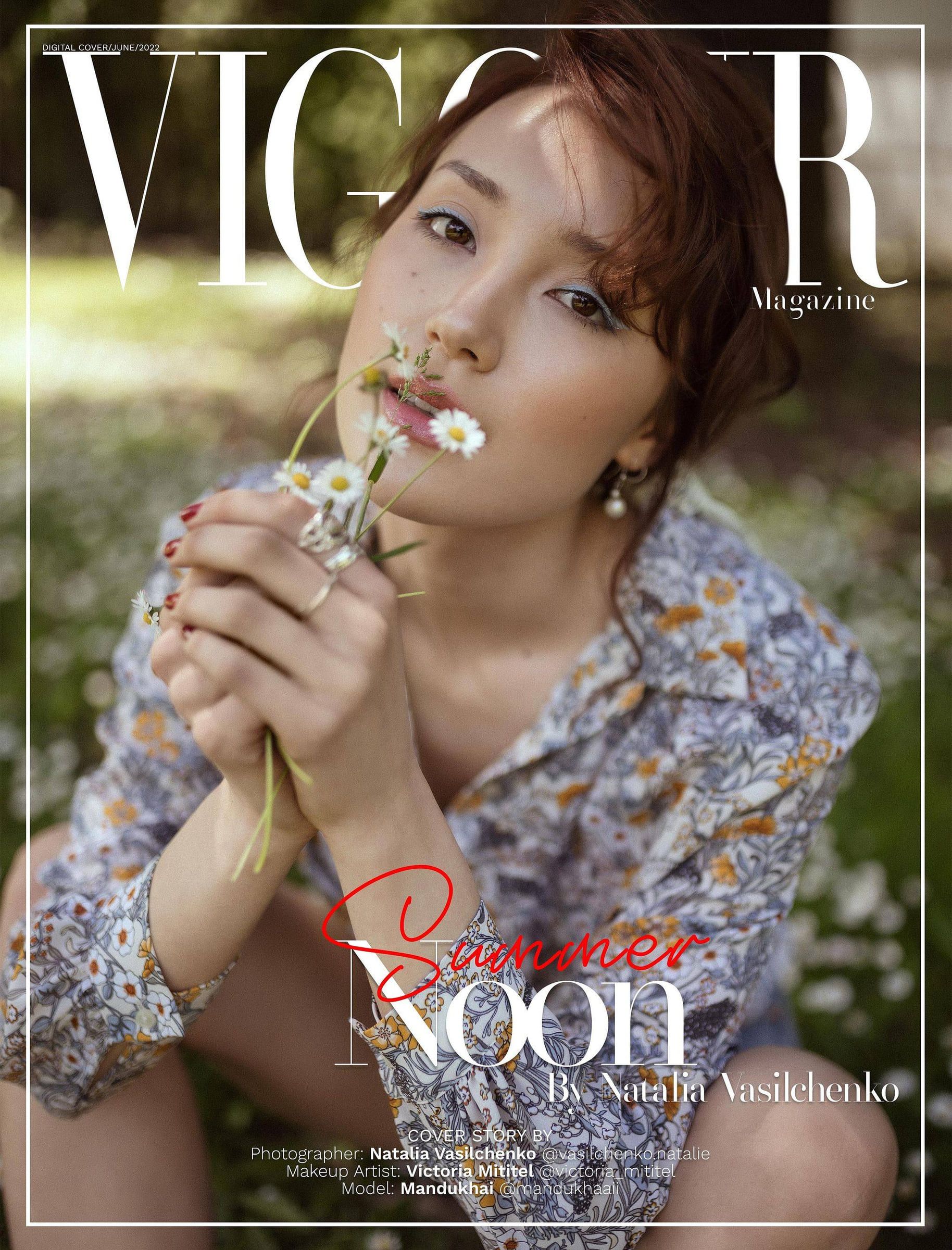 Vigour magazine cover featuring a model in a floral dress holding a wildflower