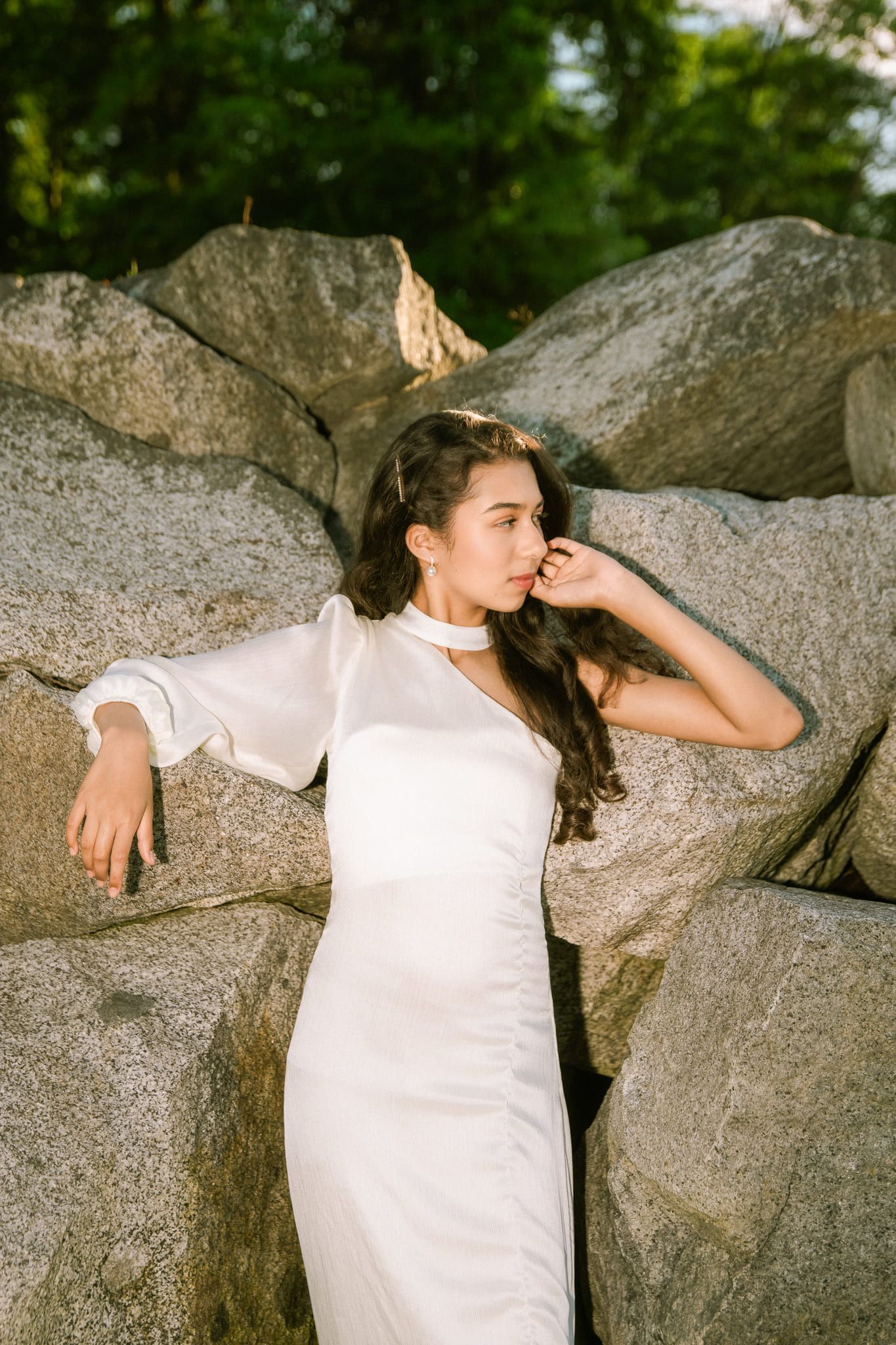 Beach portrait photography at sunset, young woman in a white gown