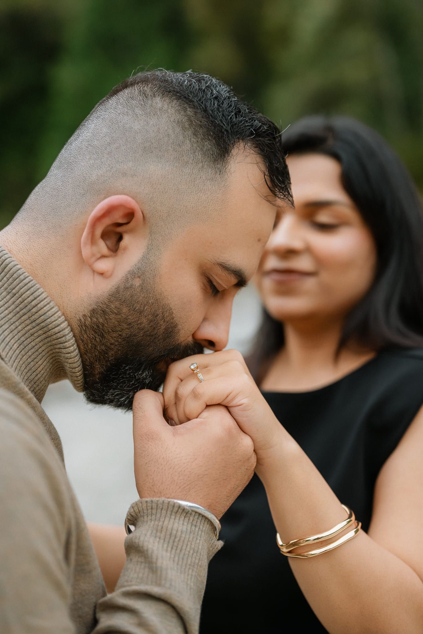Engagement sessions, man kissing his partner's hand