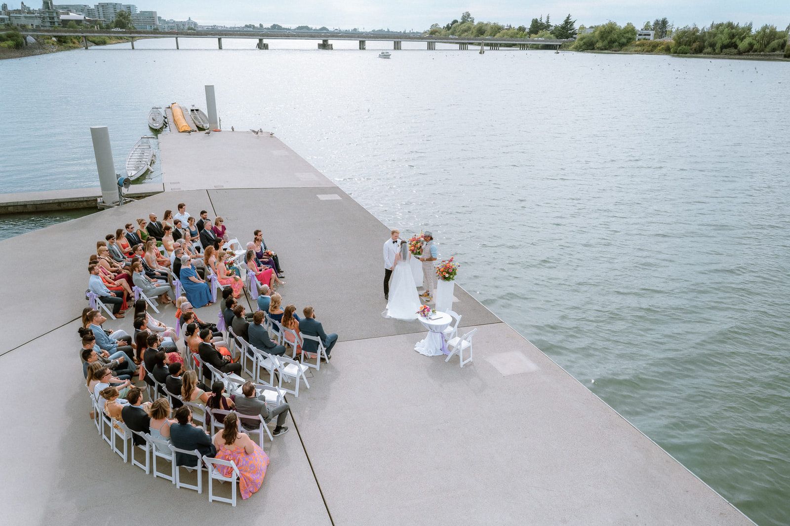 Wedding photography in Port Coquitlam, aerial view of a waterfront wedding ceremony on a pier