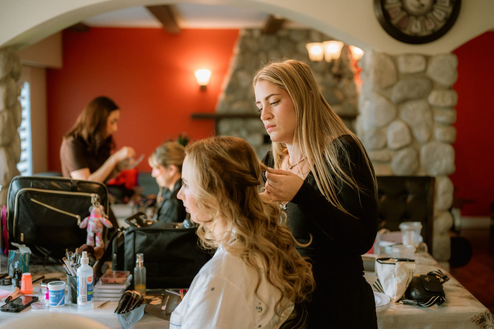 Langley wedding photography, bride having her hair done by a stylist on the morning of the wedding
