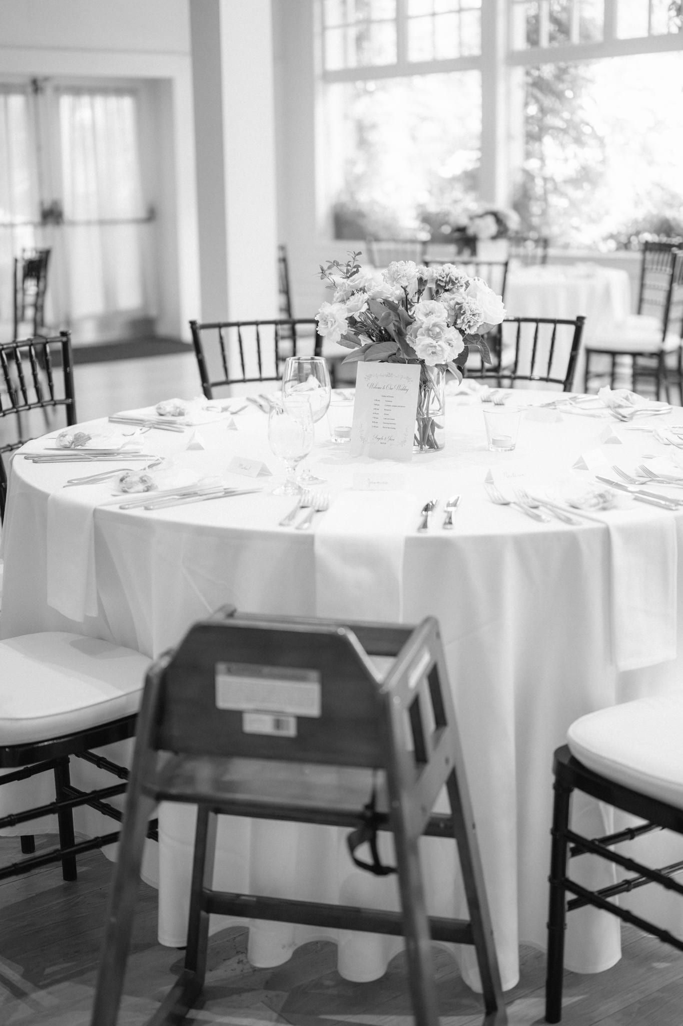 Black-and-white photo of the reception tables in the conservatory