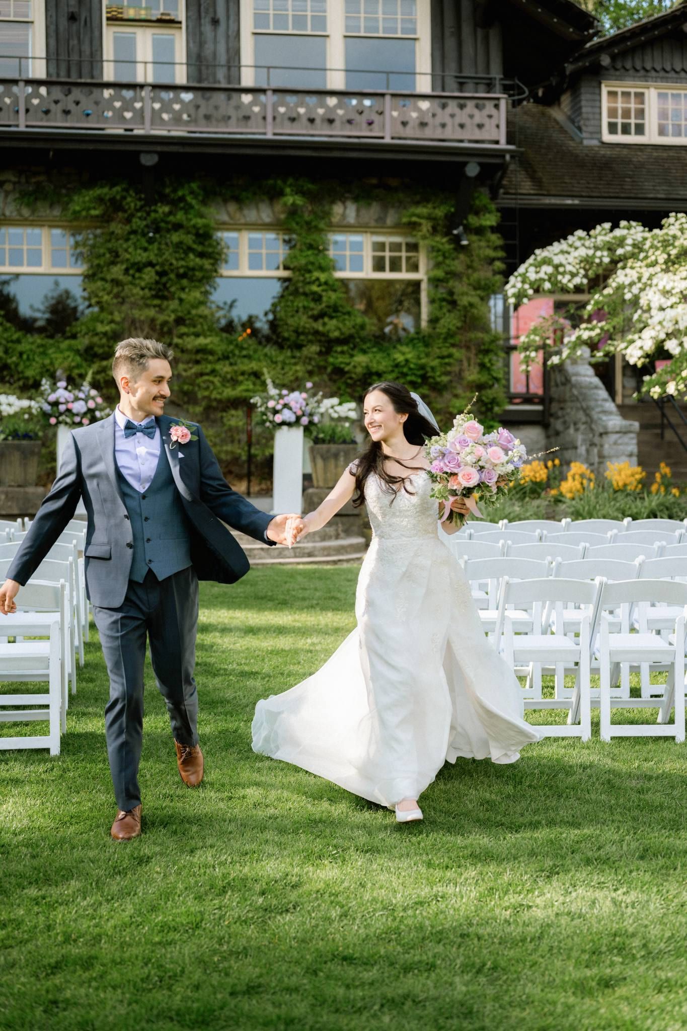 Newlyweds walking back up the aisle past their guests