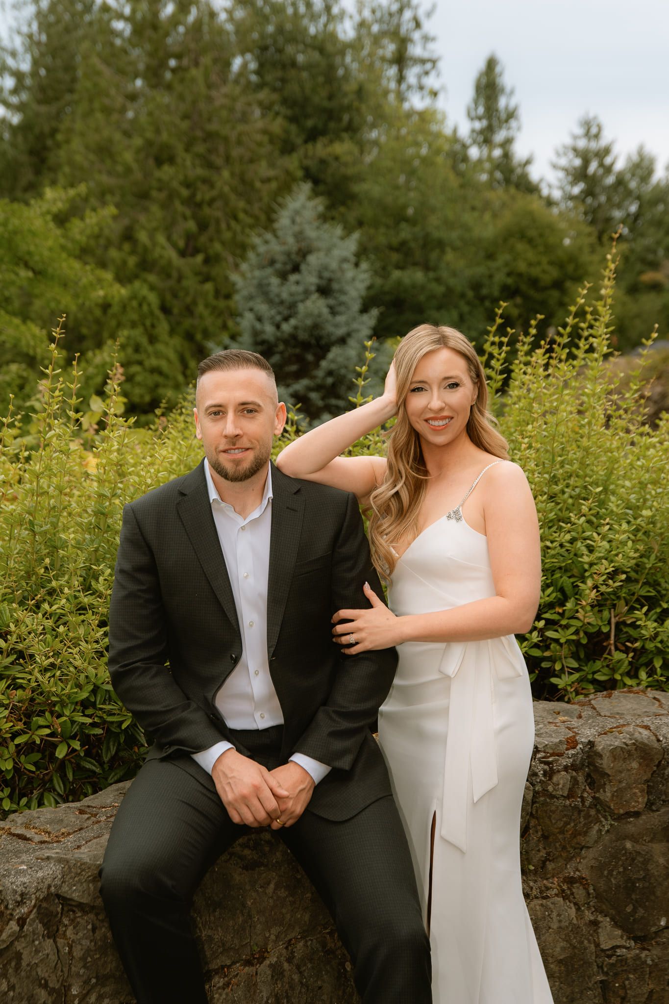 Modern engagement pictures in a garden, engaged couple in formal wear