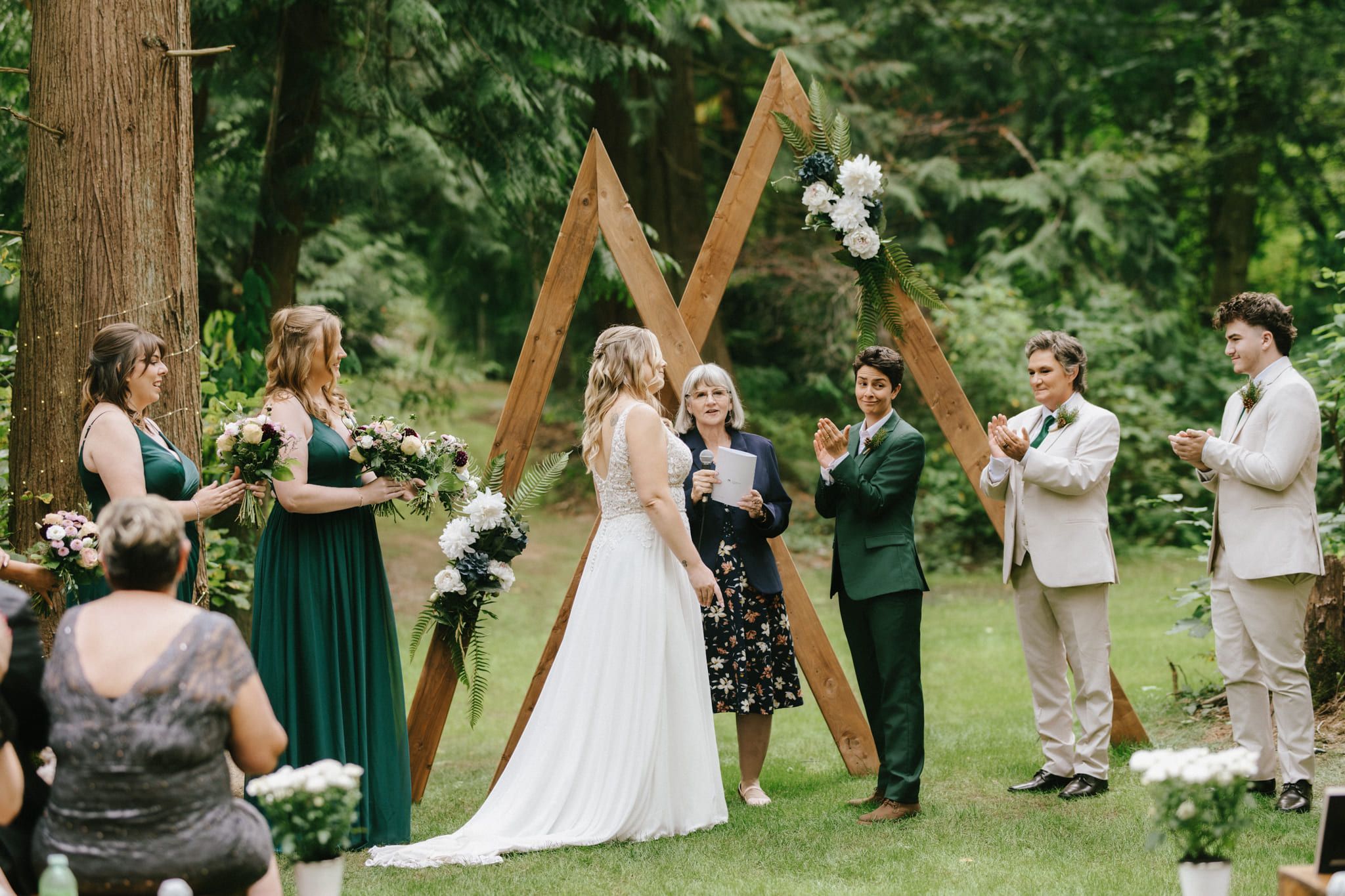 Outdoor wedding shoot under a wooden arch, garden wedding ceremony