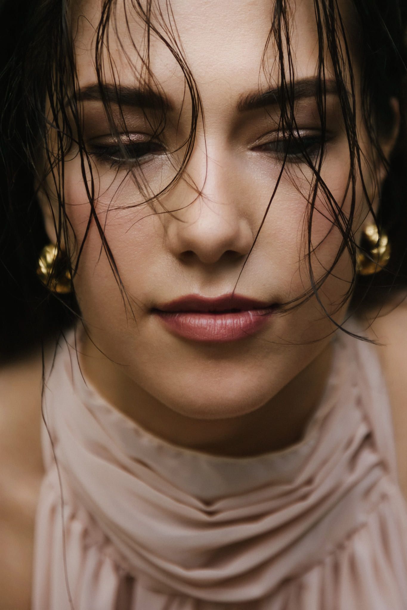 Woman in a blush gown, an editorial portrait in a glass greenhouse, by Port Moody portrait photographer Natalie Varro