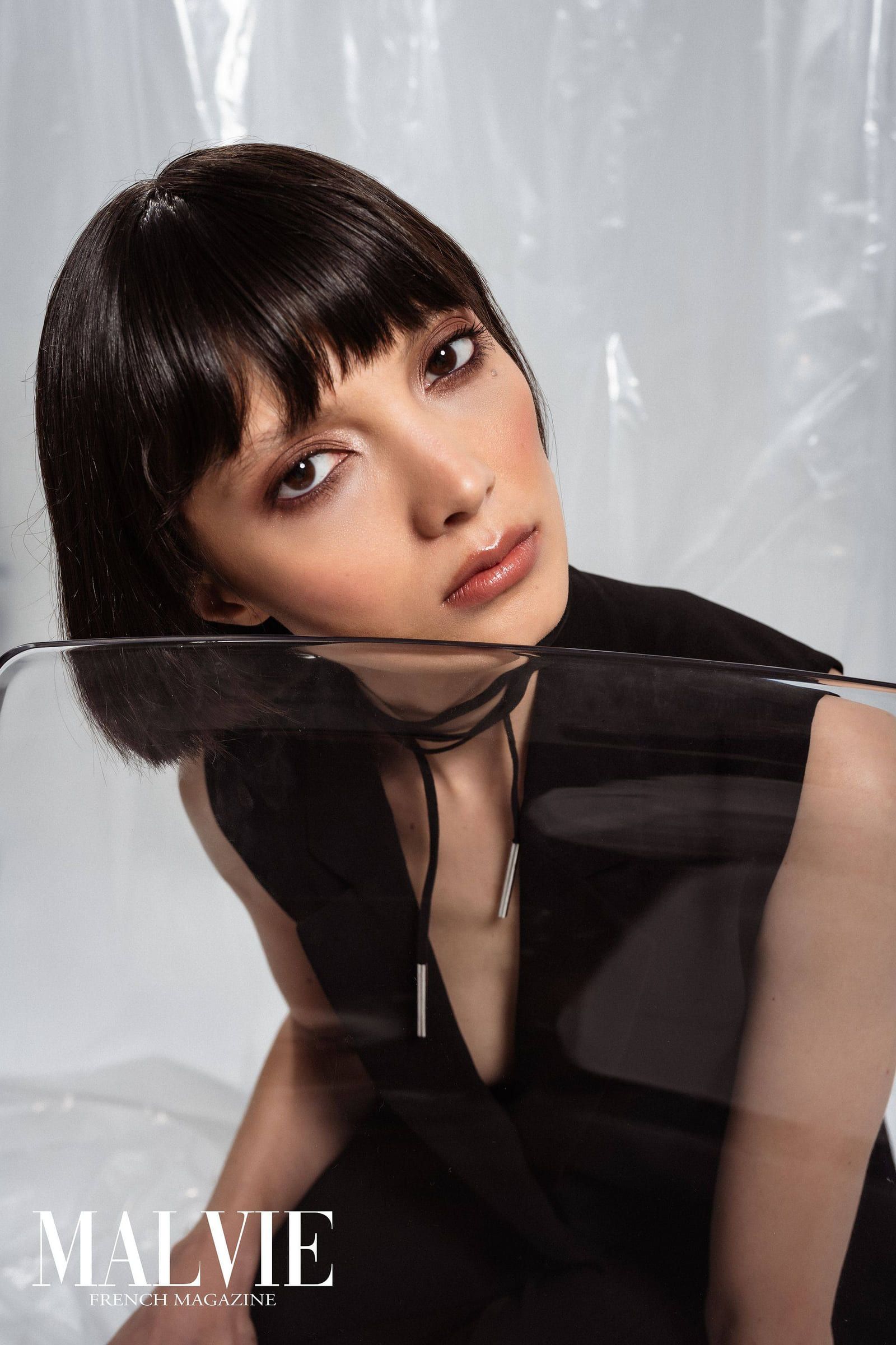 Model with a dark bob under a sheer veil on the cover of Malvie magazine