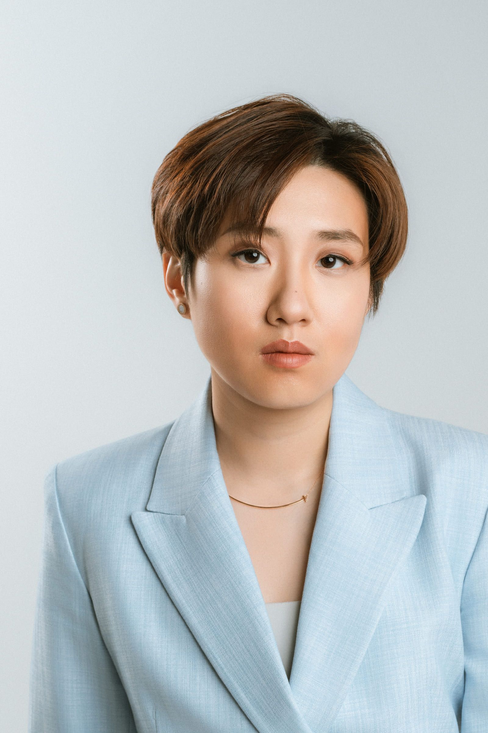 Professional headshot of a woman in a tailored suit, by Coquitlam headshot photographer Natalie Varro