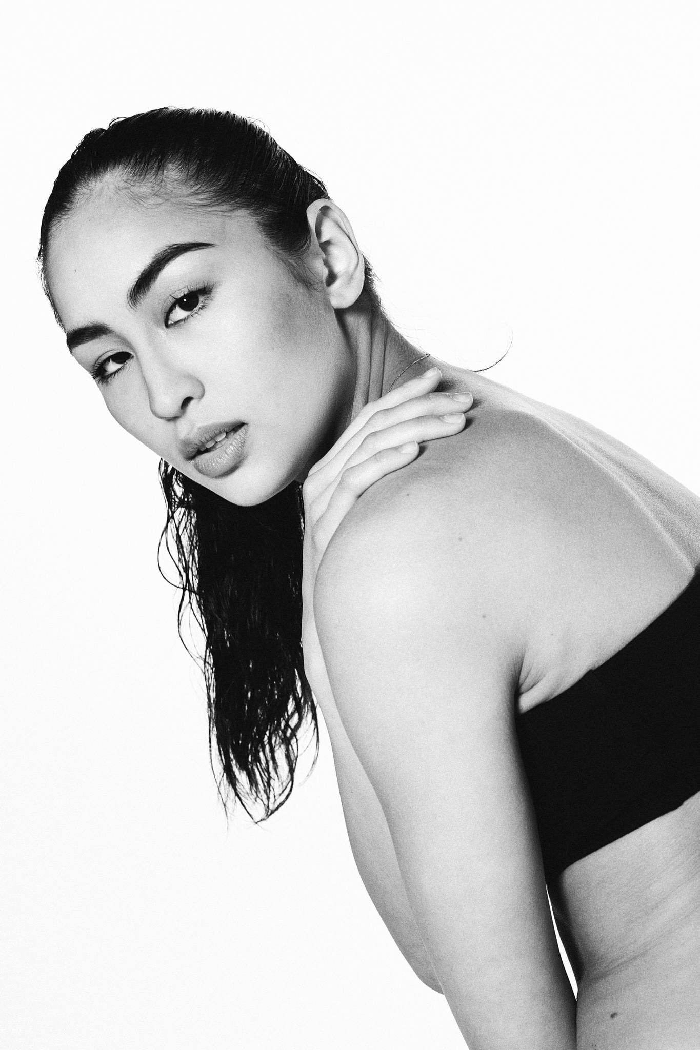 Black-and-white beauty portrait of a model with slicked-back hair