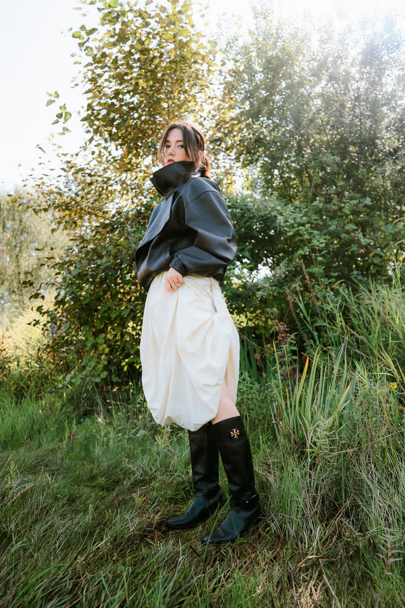 Branding photography by a mountain lake, woman in an editorial portrait