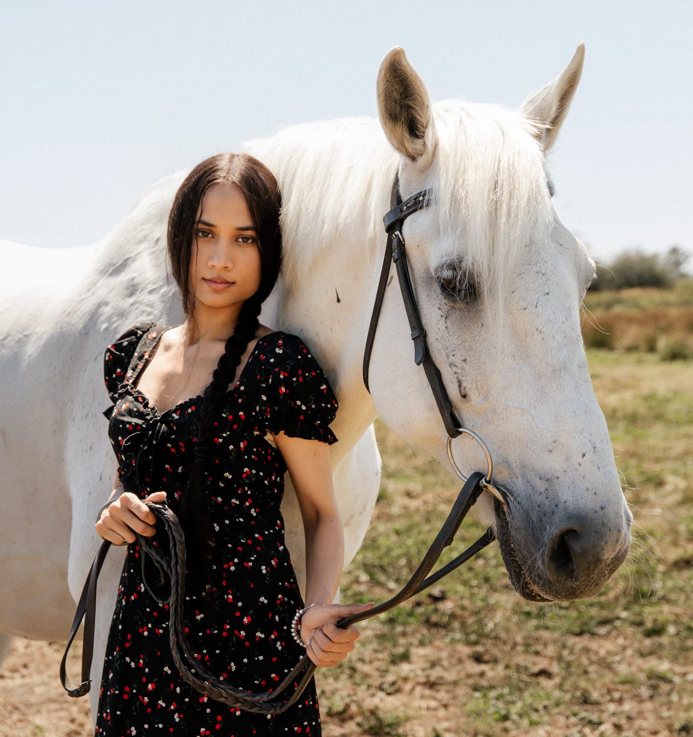 Langley portrait photographer, young woman in a floral dress standing beside a white horse