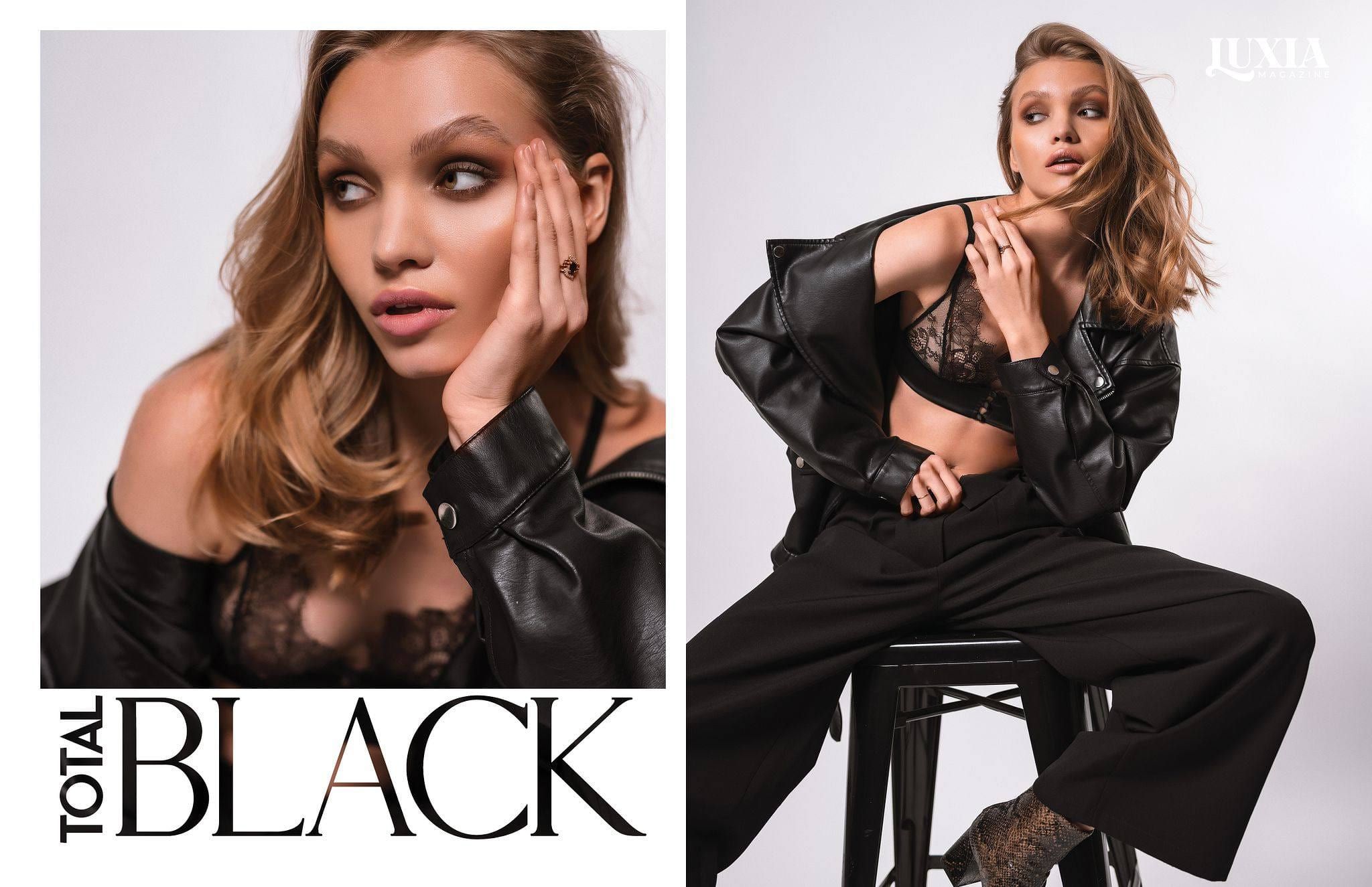 Total Black magazine spread with a model in black leather, crouching and reclining