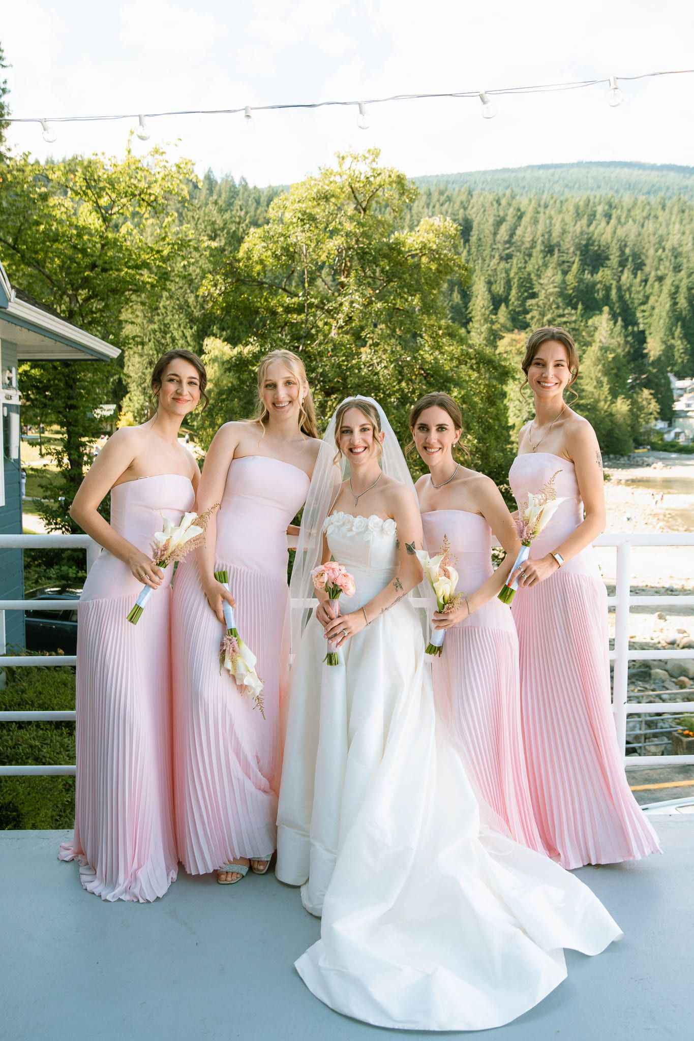 Bridal shoot on a terrace, bride with bridesmaids in pink