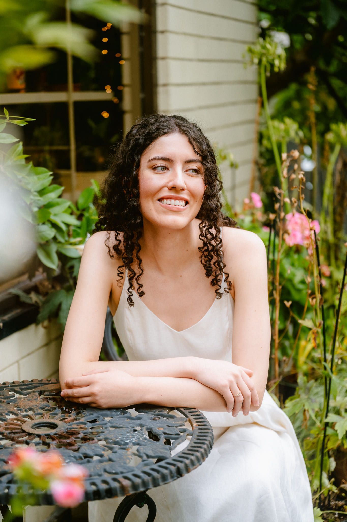 Natural portrait photography on a village street, woman with curly hair