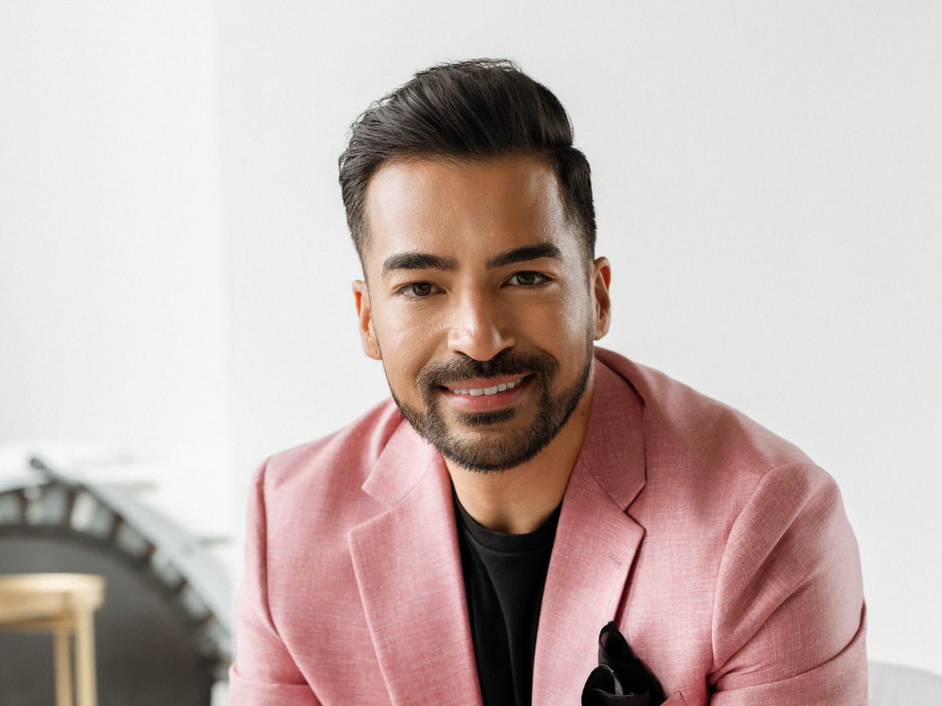 Langley headshot photographer, smiling man in a pink blazer, a professional headshot in a bright studio