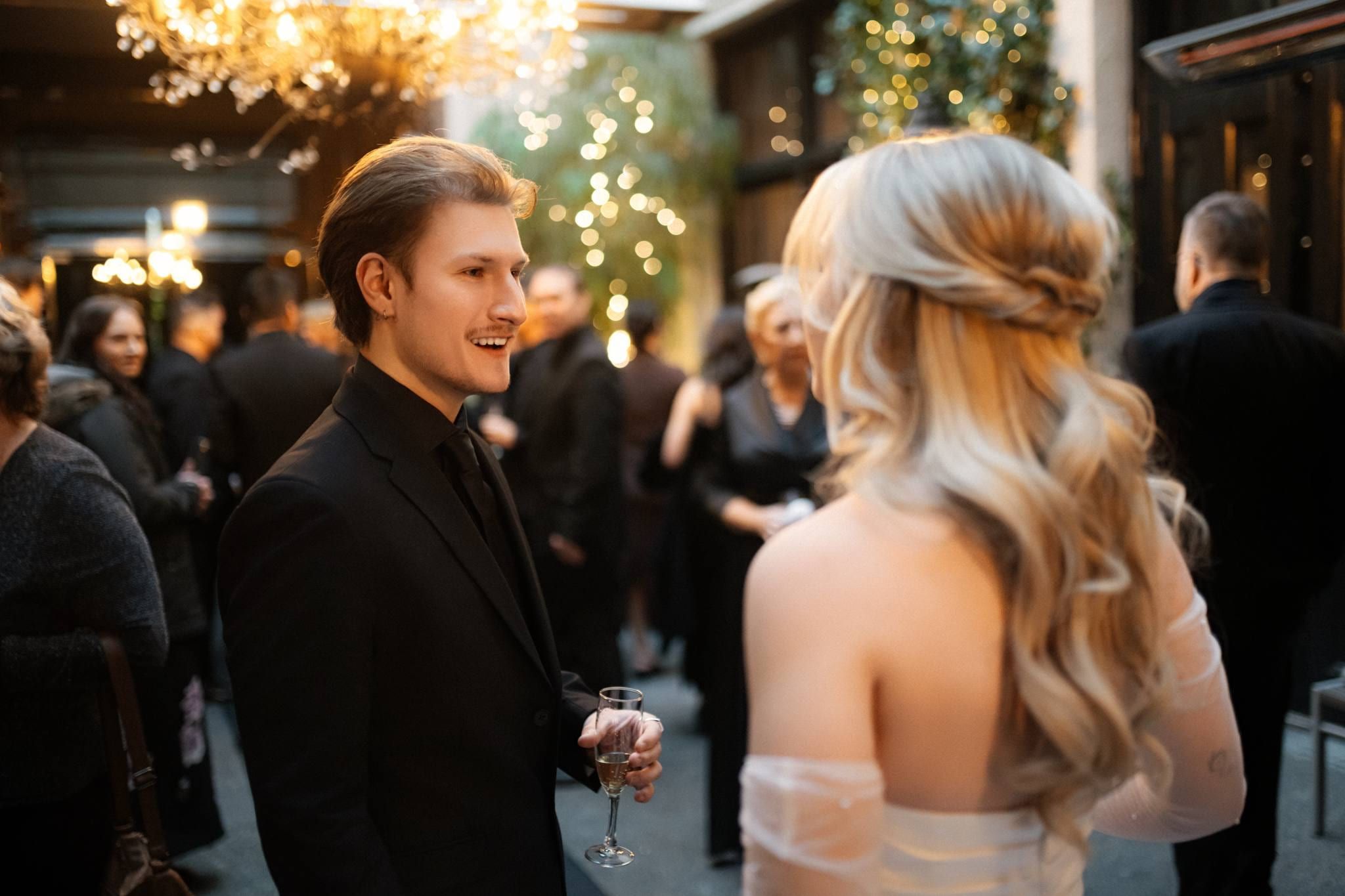 Groom looking at the bride during the ceremony in the courtyard