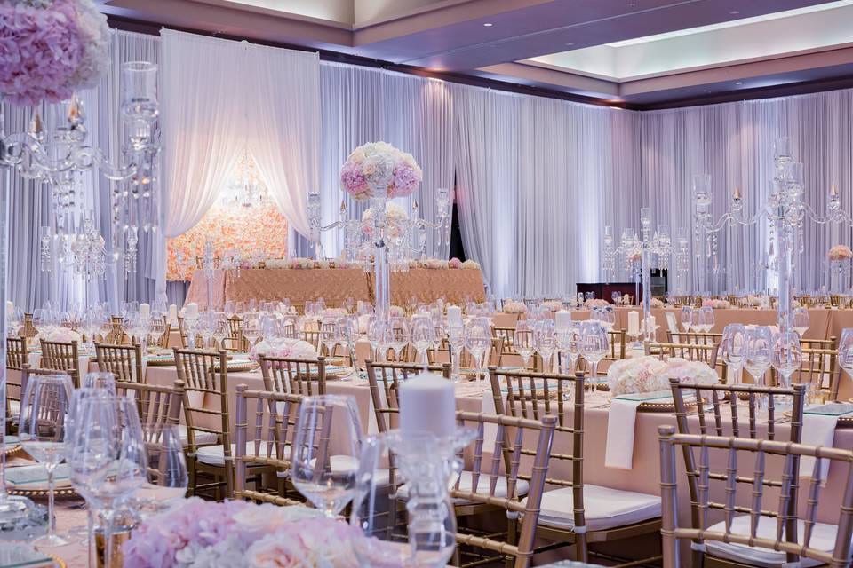 Classic wedding photos, ballroom decorated for a wedding with draped white fabric